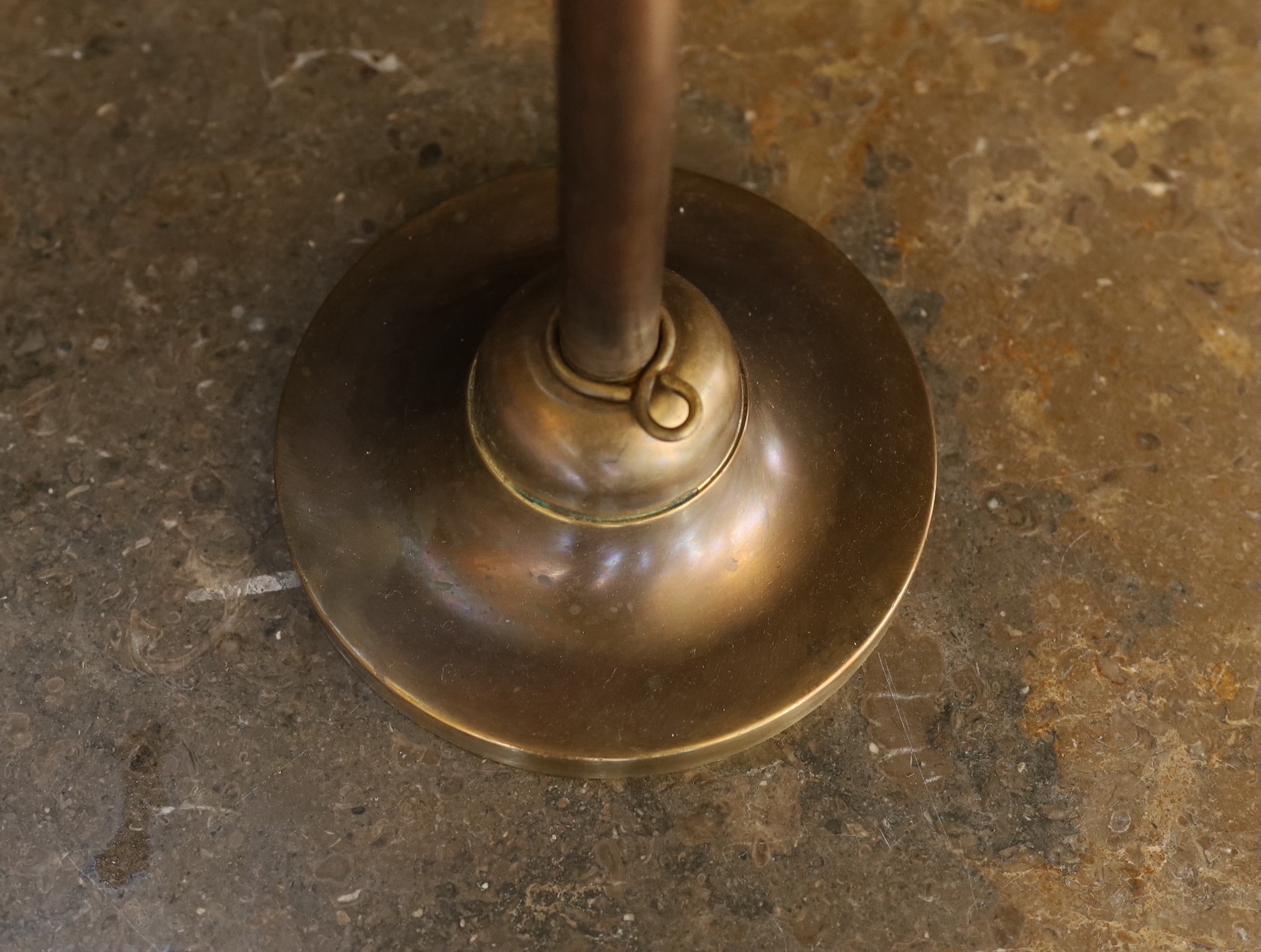 An Edwardian style bronze metal desk lamp with angel wing motif and cranberry tinted etched glass shade, height 49cm